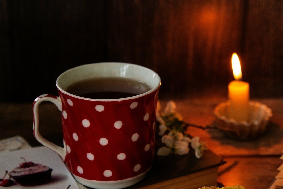 A warm cup of tea and a candle during an evening wind-down