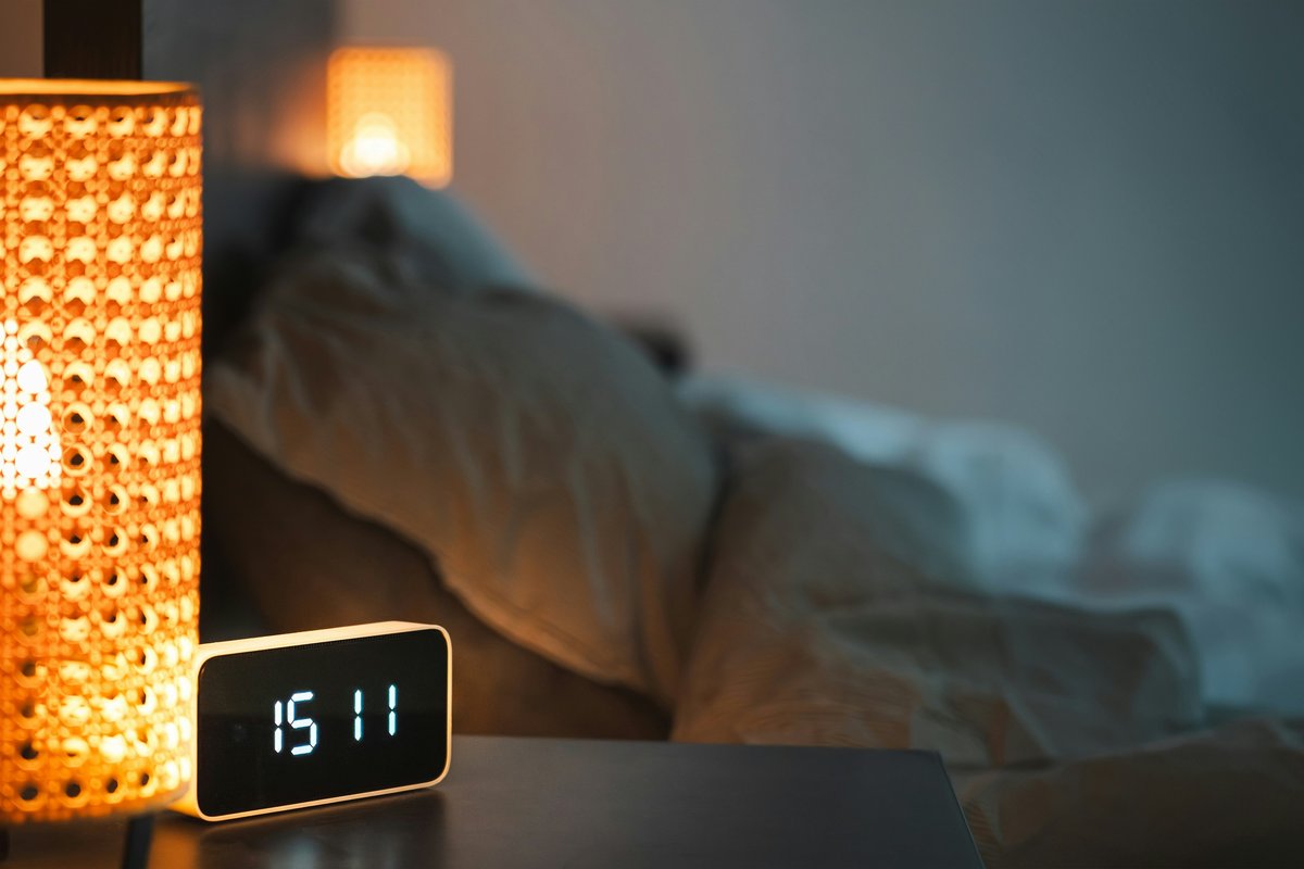 A warm bedside lamp glowing in the evening